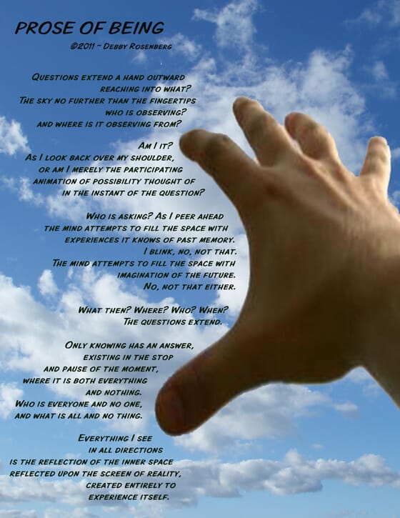 photo of hand reaching to the sky