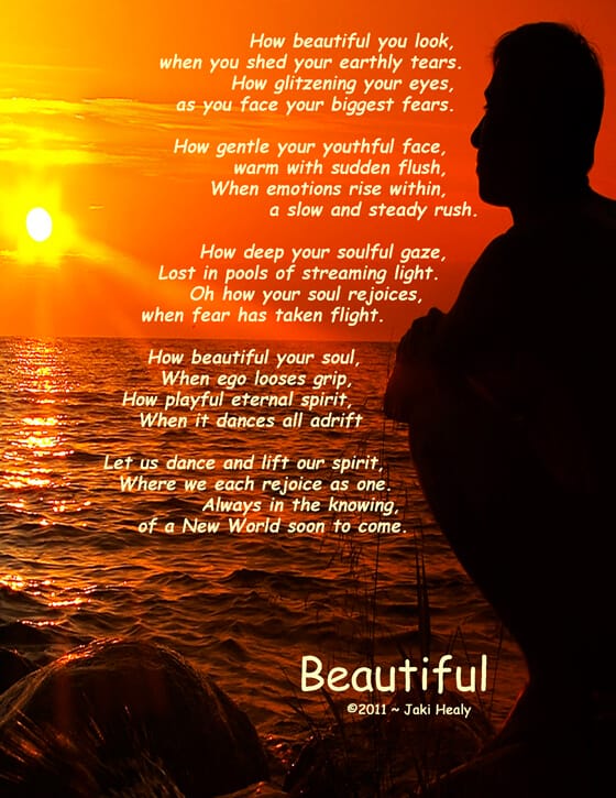 man on a beach watching the sunset