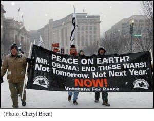 Veterans marching with banner for peace